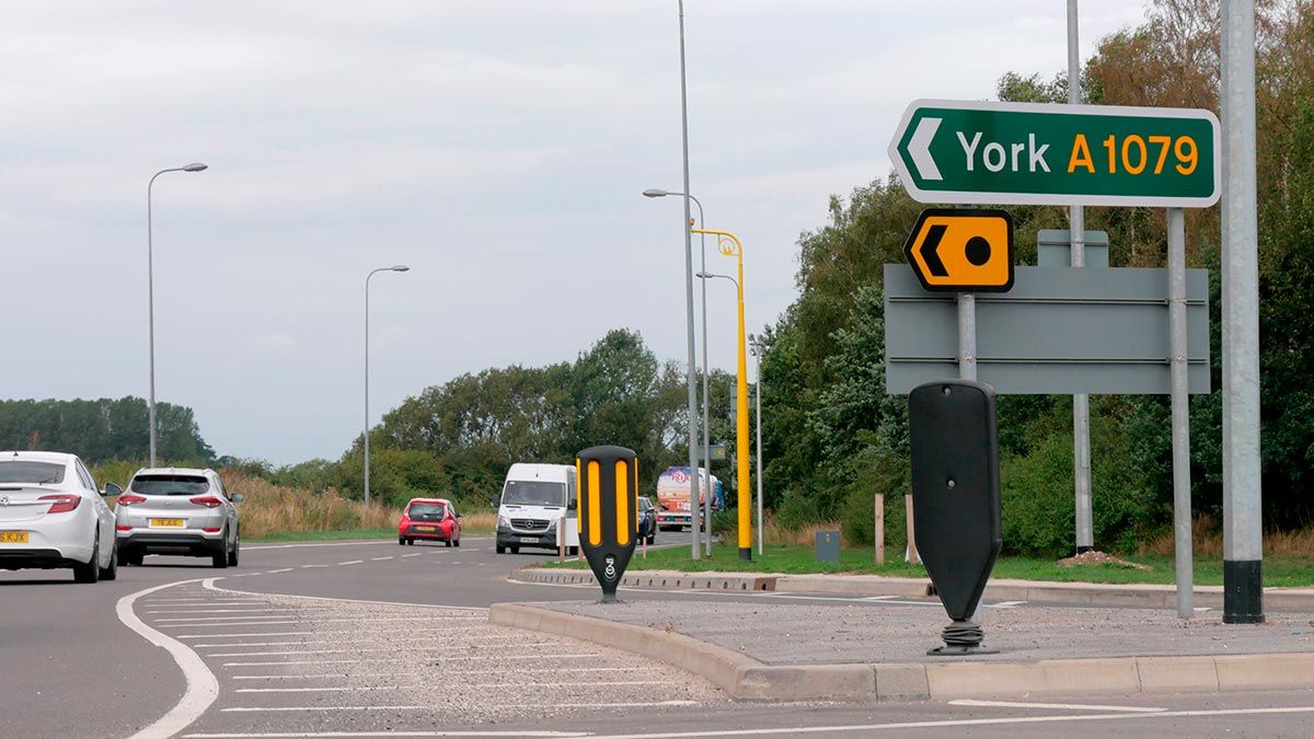 A1079 road at Market Weighton with road sign showing directions to York