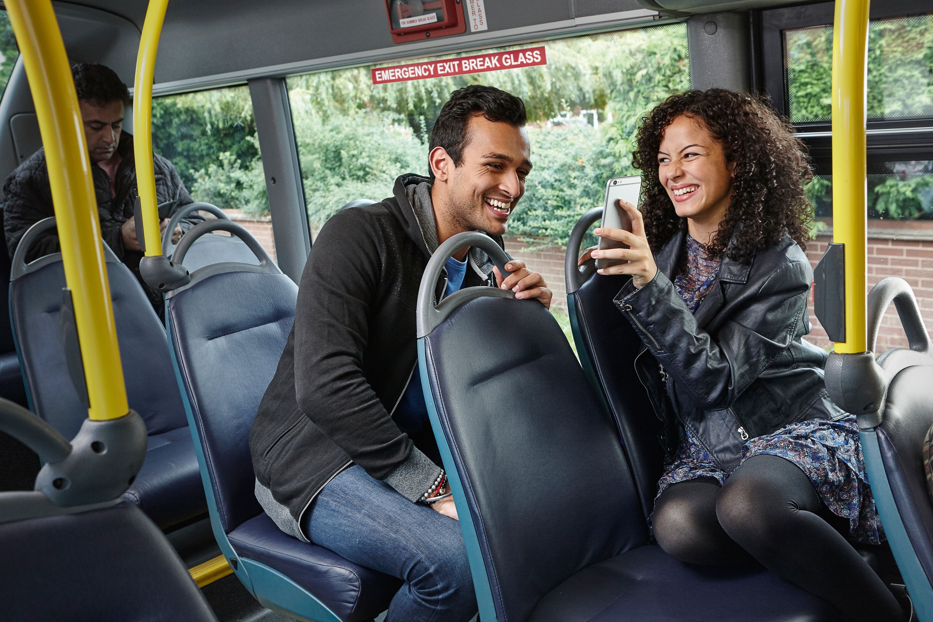 Man and woman couple travelling on an Arriva Sapphire bus
