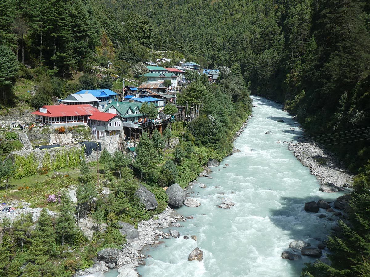village overlooking river in himalayas