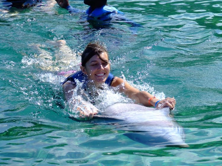 Laura getting a ride with a Dolphin